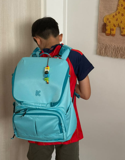 Child with a blue backpack