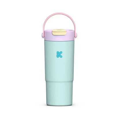 A light blue insulated travel tumbler with a pink carrying handle and a lavender lid, featuring a blue 'Kandis' logo on the front.